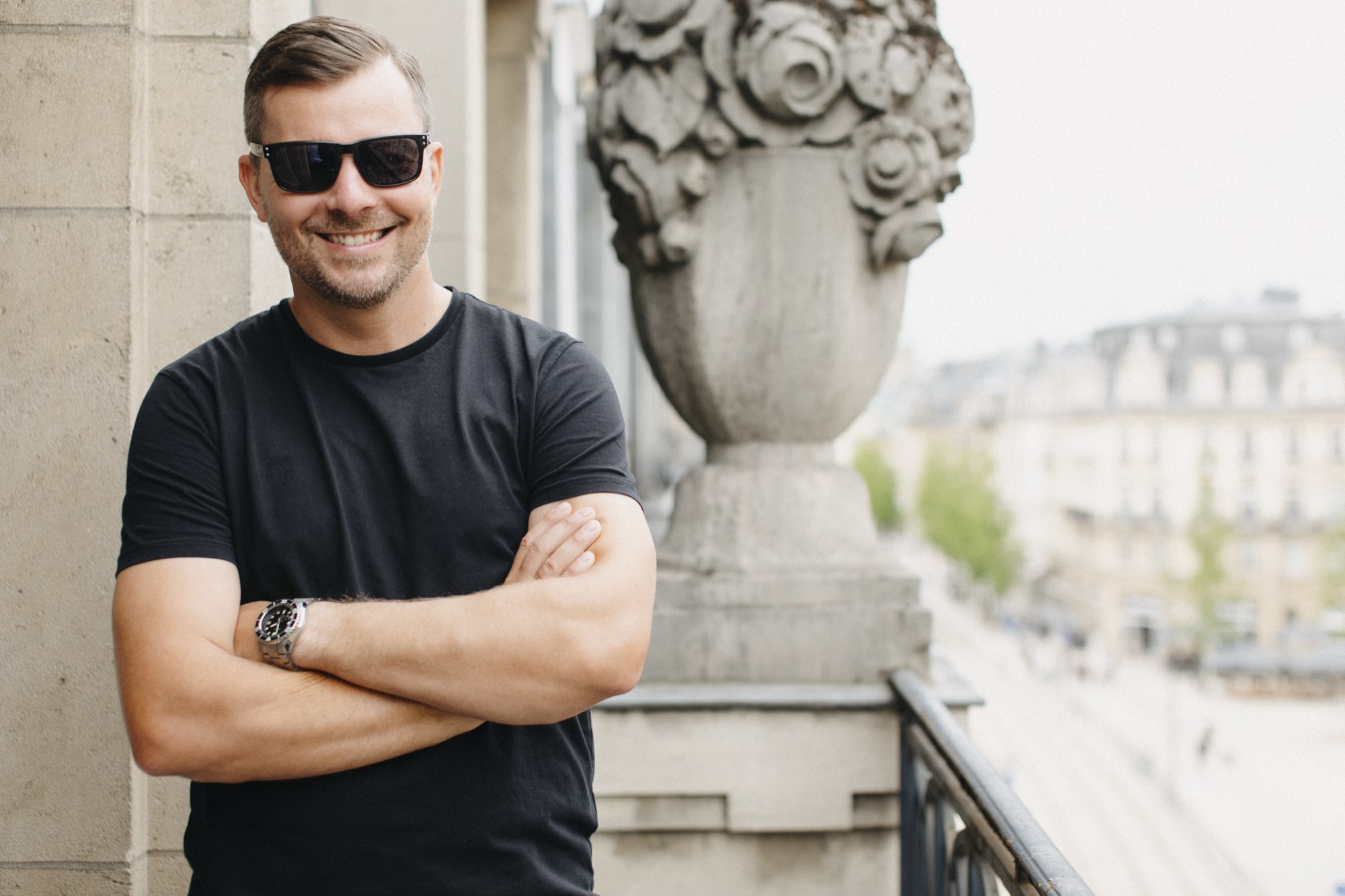 Tomasz Kramer on a balcony overlooking a Luxembourg streetscape